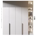 Modern Storage Cabinet With White Panels Gold Handles And Adjacent Bookshelf With Books Decorative Items