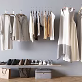 Stylish Clothes Display With Hanging Garments Shoes And Shopping Bags On Gray Wall Wooden Floor