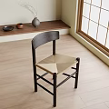 Minimalist Single Chair With Dark Wooden Frame And Light Woven Seat In Bright Room