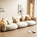 Plush Beige Three Seater Sofa With Decorative Pillows Floor Lamp Wall Art And Green Plant In Cozy Living Room