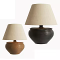 Brown And Black Table Lamps With Textured Ceramic Bases And Beige Fabric Shades
