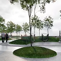 Scenic Park Landscape Featuring People Walking Green Trees Curved Pathway And Grass Lawn