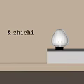 Modern Elegant Table Lamp With Pleated Lampshade On White Shelf Beige Wall Soft Light