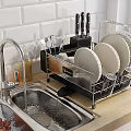 Modern Kitchen Design Featuring Sink Plates Utensils Glasses White Tiles And Cabinets On Light Countertop