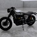 Vintage Silver and Black Motorcycle with Black Leather Seat on Industrial Gray Concrete Floor