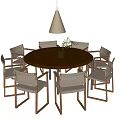 Round Wooden Dining Table with Rattan Chairs and Hanging Pendant Light in Dining Room