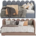 Cozy Kids Bed with Scalloped Headboard Blue Tan Blankets and Pillows