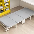 Foldable Gray Mattress Bed With Wheels In Room With Yellow Bookshelf And Wooden Floor