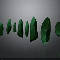 Green Crystals in Various Shapes with Glossy Surface on Gray Background