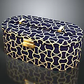Stylish Navy Blue Ottoman with Gold Geometric Pattern and Gold Handles