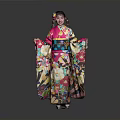 Woman Wearing Colorful Kimono With Floral Patterns Standing Against Gray Background