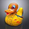 Yellow Rubber Duck Doll With Purple Blue Eyes And Decorative Patterns