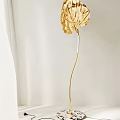 Elegant Gold Leaf Shaped Floor Lamp With Modern Curved Stem Design 3d model