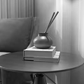 Decorative Ornament Set Featuring Silver Vase Incense Sticks On Books Round Side Table Gray Sofa