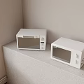 Two White Microwaves Kitchen Appliances On Light Colored Countertop With Window 3d model