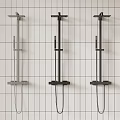 Three Stylish Modern Shower Systems Mounted on Grid Patterned White Wall
