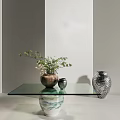 Glass Top Coffee Table Supported by Decorative Vases with Green Plant and Patterned Design