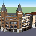 Classic Hotel Building With Twin Clock Towers And Arch Windows Design