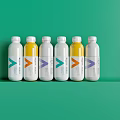 Six Bottled Beverages with Vibrant Color Labels on Green Background