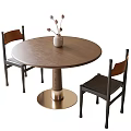 Minimalist Wooden Round Dining Table With Metal Base Two Chairs And Vase With Dried Flowers