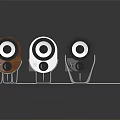 Three Compact Brown White Black Speakers with Circular Drivers on Stands Dark Background Reflection
