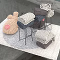 Knitted Pig Dolls In Gray And Beige On A Soft Carpet With Stacked Knitted Items