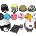 Collection of Various Helmets and Accessories Including Notebook Colored Pencils and Headphones