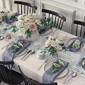 Elegant Dining Table Set With Black Chairs Tablecloth And Flower Centerpieces