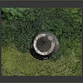 Detailed Miniature Stone Tower Model With Green Trees And Grassy Base