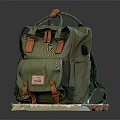 Green Canvas Backpack with Leather Accents Front Pocket and Stylish Vintage Label Design