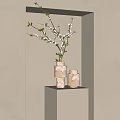 Elegant Stacked Marble Vases With White Blossom Branches On Light Pedestal Against Neutral Wall