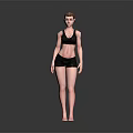 Woman in Black Sports Bra and Black Shorts Standing Barefoot on Dark Background