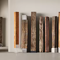 Decorative Wooden Pillars Showcasing Diverse Textures And Stone Bases In Interior Design