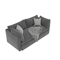 Two Seater Gray Fabric Sofa With Decorative Pillows And Fringed Blanket