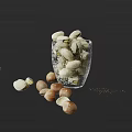 Pistachios and Hazelnuts in Glass Cup with Scattered Nuts on Dark Background