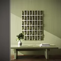 Abstract Geometric Grid Design Painting On Light Green Wall With Table Vase Plant And Books