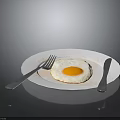 White Plate With Fresh Fried Egg Silver Fork And Knife On Black Surface