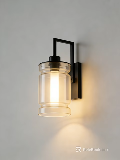 Contemporary Wall Sconce with Illuminated Clear Glass Shade and Black Metal Bracket on White Wall 3d model 