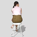 A Woman Sitting On White Stool Wearing Pink Top Green Shorts And Beige High Heels