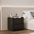 Black Bedside Table With Lamp And Decorative Items Next To White Bed In Modern Bedroom
