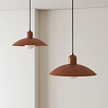 Two Brown Pendant Lights with Round Shades Hanging on White Wall in Modern Interior