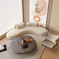 Curved Beige Sofa And Round Coffee Table Set With Decorative Items In Modern Living Room