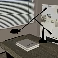 Black Adjustable Arm Desk Lamp On Desk With Book And Window Blinds