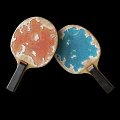 Two Table Tennis Paddles With Orange White Marbled Surface And Dark Handles As Sport Equipment