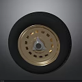 Sleek Car Parts Black Tire And Gold Perforated Wheel Rim Design