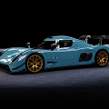 Blue Sports Car With Gold Wheels And Rear Wing On Black Background