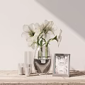 Transparent Glass Vase With White Flowers On Wooden Table With Photo Frame And Candles