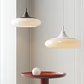 Modern Interior Pendant Lighting Design With White Shades Black White Fixtures And Red Side Table