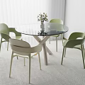 Modern Table and Chair Set with Round Glass Top Crossed Legs and Green Beige Chairs