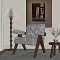 Elegant Living Room With Patterned Armchair Floor Lamp Side Table And Wall Art